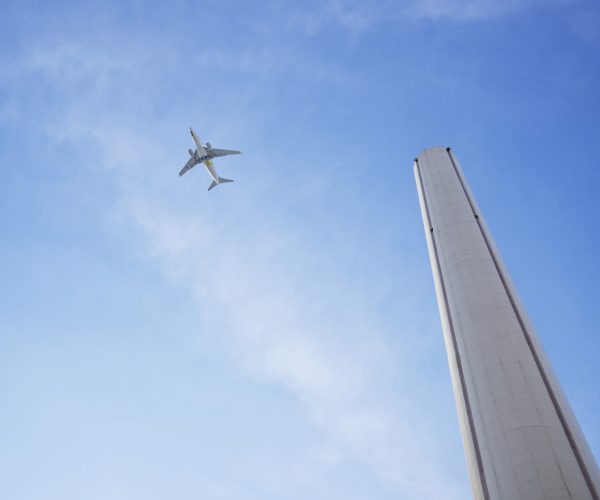 low-angle-tall-chimney-airplane